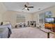 Bright playroom with twin beds, play kitchen, lots of natural light, and neutral colored carpet at 45 Cherrystone Walk, Suwanee, GA 30024
