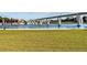Picturesque community view featuring a scenic pond, bridge, and lush green space at 45 Cherrystone Walk, Suwanee, GA 30024