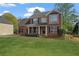 Well-maintained brick home with a manicured lawn, updated windows and a welcoming front porch at 45 Cherrystone Walk, Suwanee, GA 30024