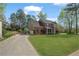 Charming brick home with attached garage and a long drive way at 45 Cherrystone Walk, Suwanee, GA 30024