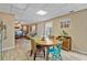 Eat-in kitchen with wood cabinets, modern appliances, and adjoining living room for easy entertaining at 45 Cherrystone Walk, Suwanee, GA 30024