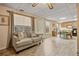 Cozy living room flowing into the dining area with wood-look floors and natural light at 45 Cherrystone Walk, Suwanee, GA 30024