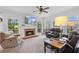 Cozy living room with a brick fireplace, and comfortable seating at 45 Cherrystone Walk, Suwanee, GA 30024