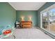 Office with a piano, and bright window with view to front yard at 45 Cherrystone Walk, Suwanee, GA 30024