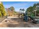 Community playground with multiple play structures, swings, and picnic tables at 45 Cherrystone Walk, Suwanee, GA 30024
