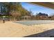 Outdoor pool with a covered gazebo and privacy fence in a residential community at 45 Cherrystone Walk, Suwanee, GA 30024