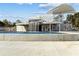Modern pool and splashpad area with sleek waterfall feature and shaded lounge spaces at 45 Cherrystone Walk, Suwanee, GA 30024