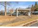 Community pool area with a covered shelter, lounge chairs, and tennis court at 45 Cherrystone Walk, Suwanee, GA 30024