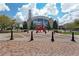 Town square with a decorative art piece in front of a building at 45 Cherrystone Walk, Suwanee, GA 30024