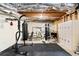 Home gym featuring a punching bag and weightlifting equipment in an unfinished basement at 6935 York Pl, Cumming, GA 30040