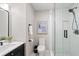 Stylish bathroom featuring a vanity with black hardware and a modern, glass enclosed shower at 6935 York Pl, Cumming, GA 30040