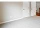 Neutral carpeted bedroom featuring white doors and light grey wall at 6935 York Pl, Cumming, GA 30040