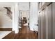 Grand foyer with soaring ceilings, hardwood floors, staircase, and elegant chandelier lighting at 6935 York Pl, Cumming, GA 30040