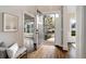 Bright foyer with hardwood floors and a view to the outside, showcasing natural light and an open floor plan at 6935 York Pl, Cumming, GA 30040