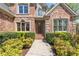 Charming brick home with manicured landscaping and welcoming entrance, exuding curb appeal at 6935 York Pl, Cumming, GA 30040