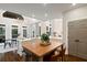 Spacious kitchen with a wooden island, stainless steel appliances and a view to the breakfast area at 6935 York Pl, Cumming, GA 30040