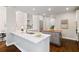 Modern kitchen featuring sleek countertops, stainless steel appliances and a functional center island at 6935 York Pl, Cumming, GA 30040