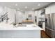 Bright kitchen with white cabinetry, stainless steel appliances, and central island for food prep at 6935 York Pl, Cumming, GA 30040