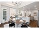 Open floor plan showcasing modern kitchen, dining area, and seamless flow into the living spaces at 6935 York Pl, Cumming, GA 30040
