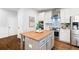 Well-designed kitchen with wooden island, stainless appliances and stylish cabinetry at 6935 York Pl, Cumming, GA 30040