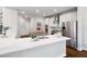 Bright, open kitchen features stainless steel appliances, white cabinets, and a large island at 6935 York Pl, Cumming, GA 30040