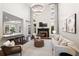 Bright, open-concept living area with a fireplace, bar, and comfortable seating at 6935 York Pl, Cumming, GA 30040