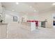 Finished basement with an island bar with seating and stainless-steel appliances and gray carpet at 931 Fairfield Dr, Marietta, GA 30068