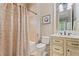 Clean bathroom with shower and tub combination with a neutral color scheme at 931 Fairfield Dr, Marietta, GA 30068