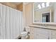 Bathroom showcasing a white vanity with granite countertop and shower at 931 Fairfield Dr, Marietta, GA 30068