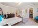 Carpeted bedroom with walk-in closet has plenty of natural light and neutral paint at 931 Fairfield Dr, Marietta, GA 30068