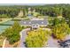 Aerial view of a clubhouse with tennis courts, lush greenery, and convenient parking at 931 Fairfield Dr, Marietta, GA 30068