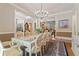 Elegant dining room with chandelier, hardwood floors, and view into other rooms at 931 Fairfield Dr, Marietta, GA 30068