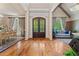 Welcoming foyer with hardwood flooring, complemented by stylish furniture and double doors at 931 Fairfield Dr, Marietta, GA 30068