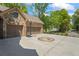 Spacious three-car garage with a basketball hoop and ample driveway space at 931 Fairfield Dr, Marietta, GA 30068