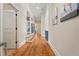 Hallway with wood floors, arched ceilings and art on the wall at 931 Fairfield Dr, Marietta, GA 30068