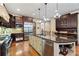 A spacious kitchen featuring a large island with granite countertops and stainless steel appliances at 931 Fairfield Dr, Marietta, GA 30068