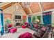 A vaulted living room with a stone fireplace, wood ceiling, and comfortable seating at 931 Fairfield Dr, Marietta, GA 30068