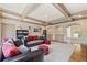 Large living room with carpet flooring, bookshelves and view of stairs at 931 Fairfield Dr, Marietta, GA 30068