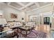 Formal living room with coffered ceilings, hardwood floors, elegant furnishings, and view of front door at 931 Fairfield Dr, Marietta, GA 30068