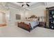 Comfortable main bedroom features a coffered ceiling, and abundant natural light at 931 Fairfield Dr, Marietta, GA 30068
