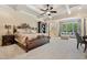 Spacious main bedroom suite featuring luxurious bed, sitting area and natural light at 931 Fairfield Dr, Marietta, GA 30068