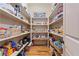 Well-stocked pantry with open shelving and ample storage for all your culinary needs at 931 Fairfield Dr, Marietta, GA 30068