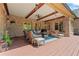 Covered brick patio with outdoor seating, ceiling fan, and view of the backyard at 931 Fairfield Dr, Marietta, GA 30068