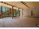 Covered patio underneath a deck with brick pillars and stairs to landscaped backyard at 931 Fairfield Dr, Marietta, GA 30068