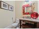 Stylish powder room with a decorative mirror and granite-topped vanity adds elegance at 931 Fairfield Dr, Marietta, GA 30068