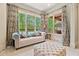 Bright sitting room with large windows, plush sofa and access to the backyard at 931 Fairfield Dr, Marietta, GA 30068