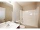 A well-lit bathroom with a combined tub and shower, modern fixtures, and a vanity sink at 1905 Granville Dr, Lawrenceville, GA 30043