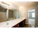 Bathroom featuring double sinks, tub, and standing shower at 1905 Granville Dr, Lawrenceville, GA 30043