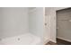 Bathroom featuring a tub and standing shower at 1905 Granville Dr, Lawrenceville, GA 30043