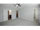 Light gray bedroom featuring a ceiling fan and carpet floors at 1905 Granville Dr, Lawrenceville, GA 30043